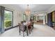 Bright dining area with stylish lighting, large windows, and an open view to the living room at 168 Constitution Blvd # 12, Lawrenceville, GA 30046