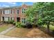 Traditional brick townhome with inviting curb appeal and mature landscaping at 168 Constitution Blvd # 12, Lawrenceville, GA 30046