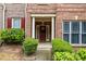 Inviting front entrance with a red door and decorative wreath at 168 Constitution Blvd # 12, Lawrenceville, GA 30046