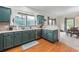 Charming kitchen with generous counterspace and hardwood flooring at 168 Constitution Blvd # 12, Lawrenceville, GA 30046