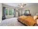 Spacious main bedroom with large windows and neutral carpeting at 168 Constitution Blvd # 12, Lawrenceville, GA 30046