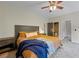 Comfortable main bedroom with plush carpeting, neutral walls, and access to an ensuite bathroom at 168 Constitution Blvd # 12, Lawrenceville, GA 30046
