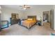 Bright main bedroom with a large bed, a dresser, and neutral carpeting at 168 Constitution Blvd # 12, Lawrenceville, GA 30046