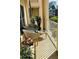 Well-lit balcony with comfortable seating, potted plants, and a small table at 211 Colonial Homes Nw Dr # 2508, Atlanta, GA 30309