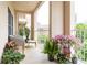 Relaxing outdoor balcony with wicker chairs, a small table, and potted plants at 211 Colonial Homes Nw Dr # 2508, Atlanta, GA 30309