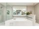 Spa bathroom with a large soaking tub, and a glass-enclosed shower at 211 Colonial Homes Nw Dr # 2508, Atlanta, GA 30309