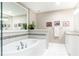 Modern bathroom featuring a luxurious soaking tub, and tile accents at 211 Colonial Homes Nw Dr # 2508, Atlanta, GA 30309