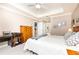 Spacious bedroom with tray ceilings and a bright window, offering a serene retreat at 211 Colonial Homes Nw Dr # 2508, Atlanta, GA 30309