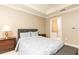 Cozy bedroom featuring a comfortable bed, bedside table, and access to an en-suite bathroom at 211 Colonial Homes Nw Dr # 2508, Atlanta, GA 30309