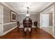 Elegant dining room with chandelier, wooden table, and hardwood floors at 211 Colonial Homes Nw Dr # 2508, Atlanta, GA 30309