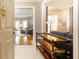 Inviting foyer with console table leading into a bright living room with hardwood floors at 211 Colonial Homes Nw Dr # 2508, Atlanta, GA 30309