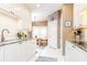 Bright eat-in kitchen features white cabinetry, granite countertops, and large windows at 211 Colonial Homes Nw Dr # 2508, Atlanta, GA 30309
