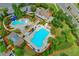 Aerial view of a community pool and clubhouse amidst lush landscaping at 4240 Hastings Dr, Cumming, GA 30041