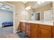 Bright bathroom with double sinks and storage at 4240 Hastings Dr, Cumming, GA 30041