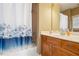 Neat bathroom with shower and bath, and storage vanity at 4240 Hastings Dr, Cumming, GA 30041