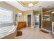 Bathroom with a garden tub, glass shower, and vanity, offering a spa-like retreat at 4240 Hastings Dr, Cumming, GA 30041