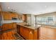 Well-appointed kitchen with a granite island, wooden cabinets, and stainless steel appliances at 4240 Hastings Dr, Cumming, GA 30041