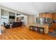 Open-concept living room flows from kitchen with granite counters and stainless appliances at 4240 Hastings Dr, Cumming, GA 30041