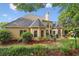 Exterior view of the home featuring a well-maintained lawn and backyard at 378 Rhodes House Dr, Suwanee, GA 30024