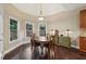 Cozy dining area with hardwood floors and backyard views at 378 Rhodes House Dr, Suwanee, GA 30024