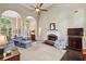 Open-concept living room with hardwood floors, fireplace, and ample seating at 378 Rhodes House Dr, Suwanee, GA 30024