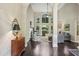 Bright living room with hardwood floors, high ceilings, and a fireplace at 378 Rhodes House Dr, Suwanee, GA 30024
