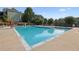 Community pool with lounge chairs and a surrounding deck area at 378 Rhodes House Dr, Suwanee, GA 30024