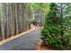 Private driveway leading to beautiful homes, surrounded by lush trees and natural landscaping at 3786 Alstead Manor Way, Suwanee, GA 30024