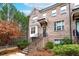 Attractive brick home with stairs, a bay window, tidy landscaping and a covered porch at 3786 Alstead Manor Way, Suwanee, GA 30024