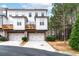 Inviting townhome with a two-car garage, a private balcony and a well-manicured lawn at 3786 Alstead Manor Way, Suwanee, GA 30024