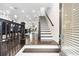 Open foyer featuring hardwood floors, staircase, and a view into the kitchen and living spaces at 3786 Alstead Manor Way, Suwanee, GA 30024