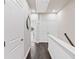 Hallway on the upper level with sleek hardwood floors, white trim, and two hall closets at 3786 Alstead Manor Way, Suwanee, GA 30024