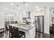 Modern kitchen featuring a central island, stainless steel appliances, and ample counter space at 3786 Alstead Manor Way, Suwanee, GA 30024