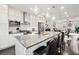 Spacious kitchen island with stainless steel appliances, and a view to the dining and living area at 3786 Alstead Manor Way, Suwanee, GA 30024