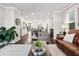 Open-concept living area with hardwood floors, comfortable seating, and ample space for entertaining at 3786 Alstead Manor Way, Suwanee, GA 30024