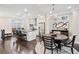 Open-concept living area with kitchen, dining and living space at 3786 Alstead Manor Way, Suwanee, GA 30024
