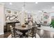 Open-concept living and dining area with hardwood floors and ample natural light at 3786 Alstead Manor Way, Suwanee, GA 30024