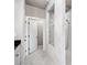 This shower features white marble-style tile and a clear glass enclosure at 3786 Alstead Manor Way, Suwanee, GA 30024