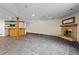 Finished basement with tile floors, wet bar, and tiled fireplace at 3863 Dundee Ne Dr, Roswell, GA 30075