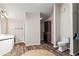 Bright bathroom featuring a vanity, toilet, and spacious walk-in closet at 3863 Dundee Ne Dr, Roswell, GA 30075