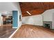 Spacious living room with wood floors and a vaulted ceiling featuring a wood finish at 3863 Dundee Ne Dr, Roswell, GA 30075