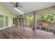 Light-filled sunroom with wood floors and panoramic views of the backyard at 3863 Dundee Ne Dr, Roswell, GA 30075