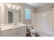 Bathroom features a tub and shower combo plus a vanity at 5280 Tussahaw Xing, Mcdonough, GA 30252