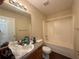 Bathroom with a granite vanity, toilet, tub and shower combination at 5280 Tussahaw Xing, Mcdonough, GA 30252
