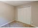 This bedroom features neutral walls, carpet and a closet for storage at 5280 Tussahaw Xing, Mcdonough, GA 30252