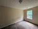Bedroom featuring carpet floors, neutral colored walls, and a window for natural light at 5280 Tussahaw Xing, Mcdonough, GA 30252