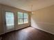 Bright dining area features wood floors, chair railing, chandelier, and a large sliding door at 5280 Tussahaw Xing, Mcdonough, GA 30252
