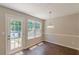 Charming dining area with natural light and wood-look flooring at 5280 Tussahaw Xing, Mcdonough, GA 30252