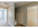 Upstairs hallway features neutral paint with access to bedrooms and stairs at 5280 Tussahaw Xing, Mcdonough, GA 30252