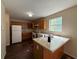 Functional kitchen design with oak cabinets, laminate countertops, and modern appliances at 5280 Tussahaw Xing, Mcdonough, GA 30252